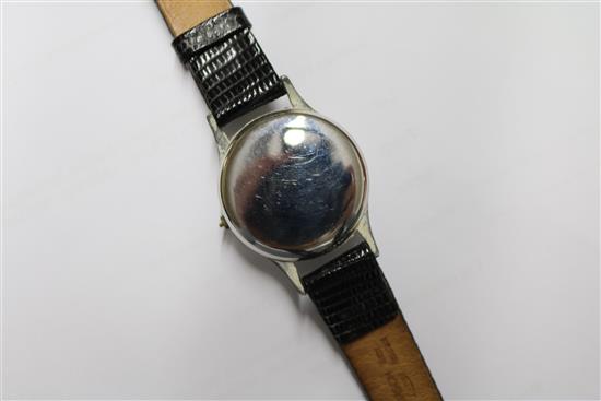 Three gentlemans assorted stainless steel wrist watches, including Longines and Roamer.